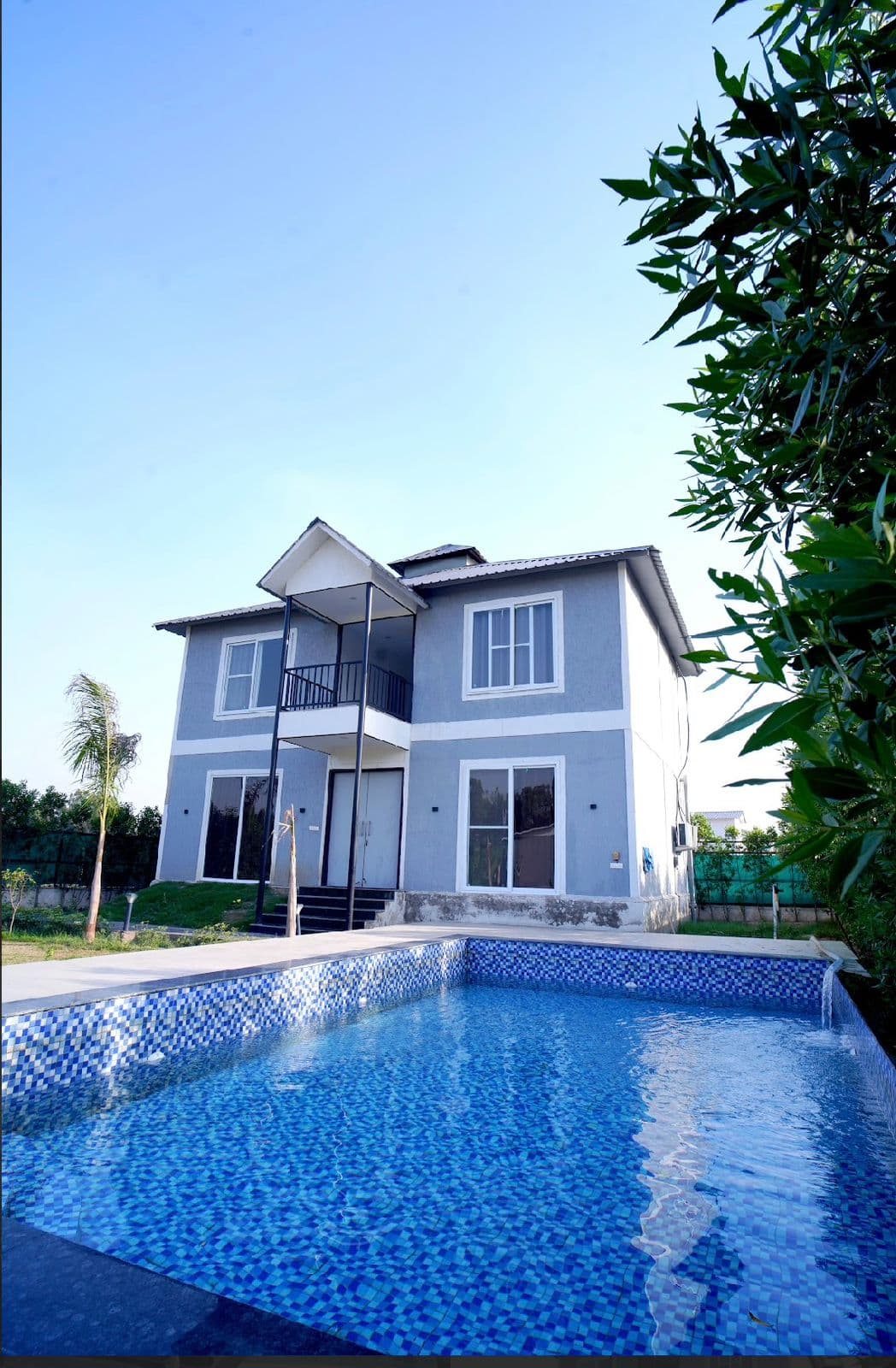 Vidhaan Farm House estate at golden hour